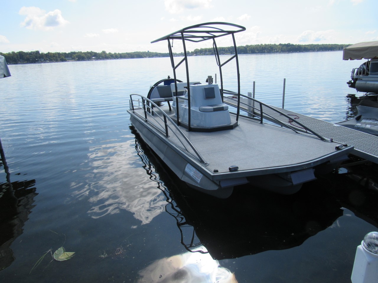 Unique custom pontoon boat with third tube installed
